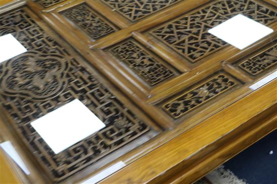 A Chinese elm panelled coffee table W.157cm